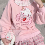 pull chat kawaii rose pastel avec bonbon